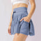 Mini spódniczka z wysokim stanem i wbudowanymi szortami, eleganckie plisowania - idealna na jesień